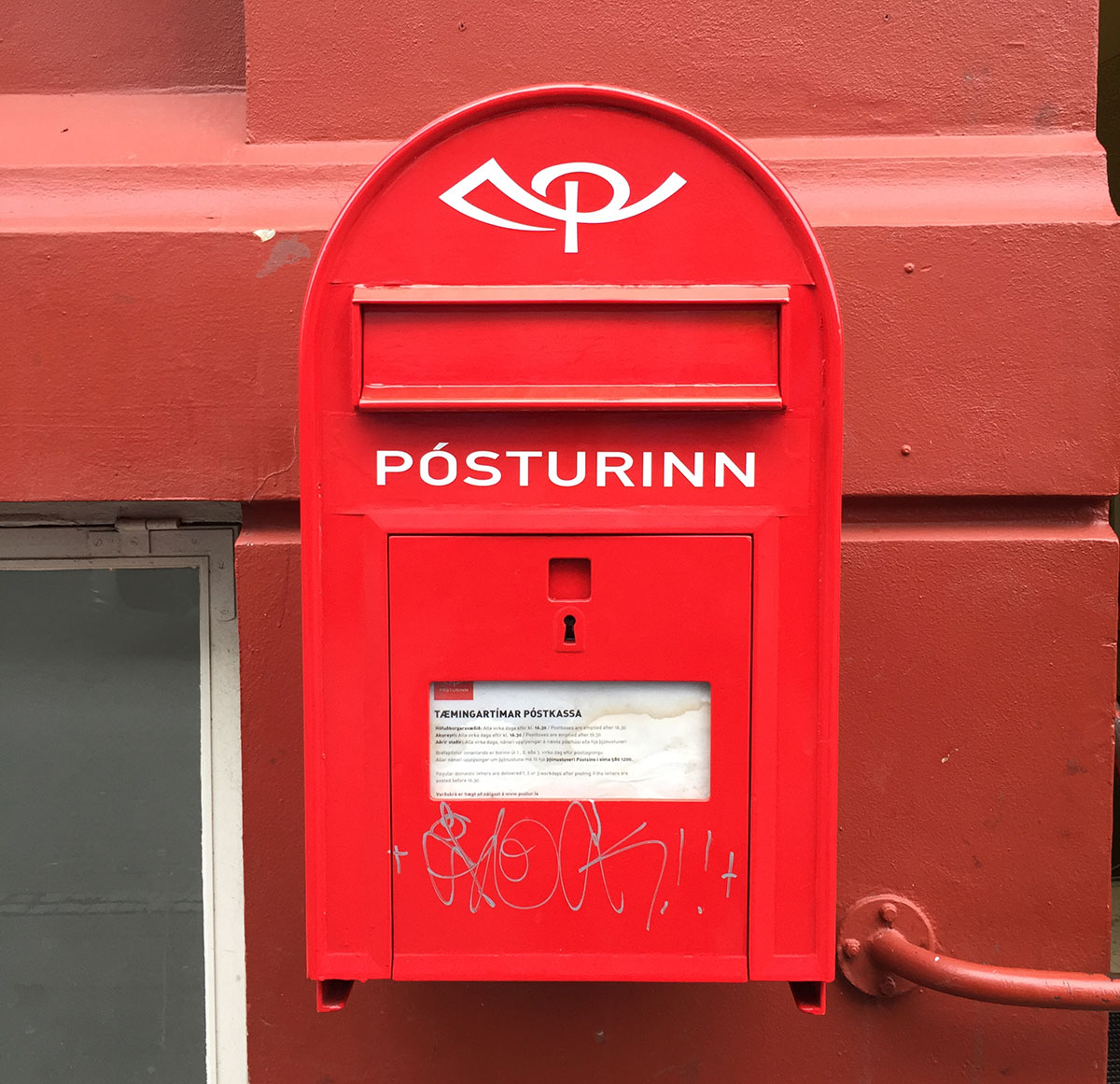 A red letterbox for the postal system in Iceland